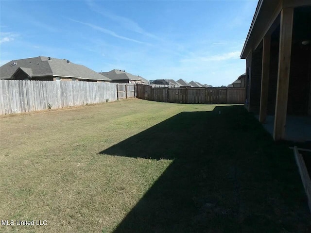 view of yard with a fenced backyard