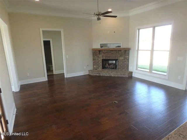 unfurnished living room with dark wood finished floors, a fireplace, baseboards, and ceiling fan