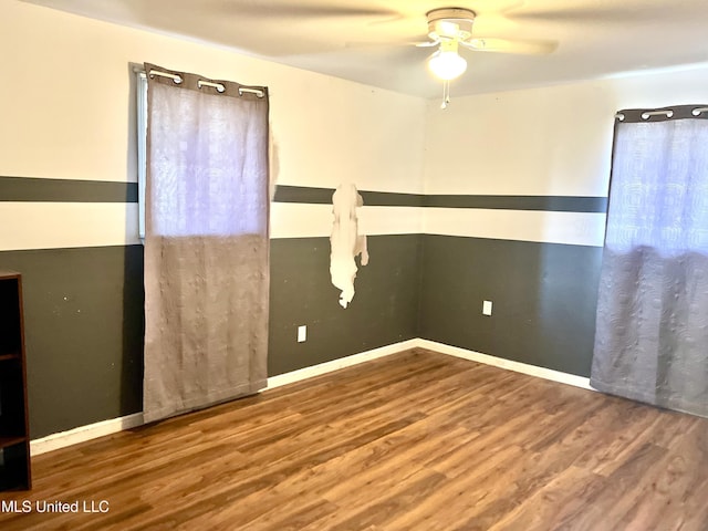 empty room featuring hardwood / wood-style flooring and ceiling fan