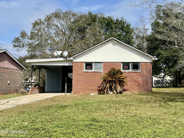 view of front facade with a carport and a front yard