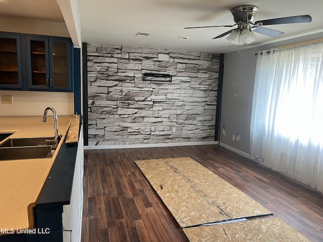 kitchen featuring a healthy amount of sunlight, sink, dark hardwood / wood-style floors, and ceiling fan