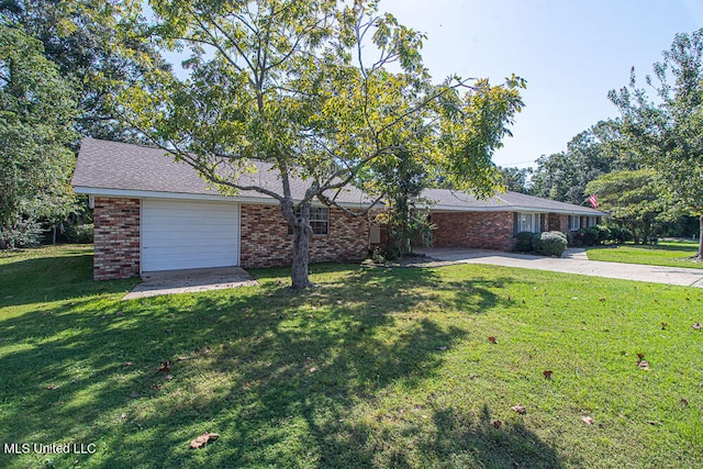 single story home featuring a front yard and a garage