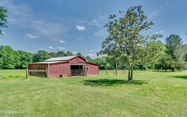 view of yard featuring an outdoor structure, an exterior structure, and an outbuilding