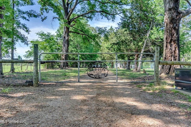 view of property's community with a gate and fence