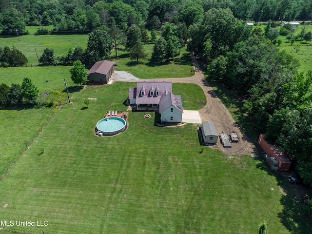 birds eye view of property with a rural view
