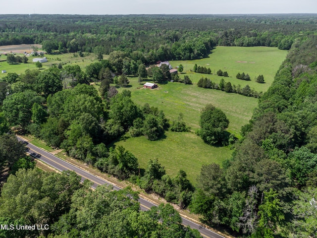 bird's eye view featuring a wooded view