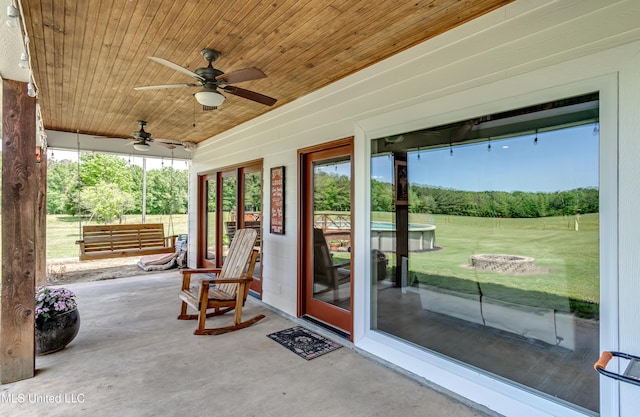 view of patio featuring ceiling fan