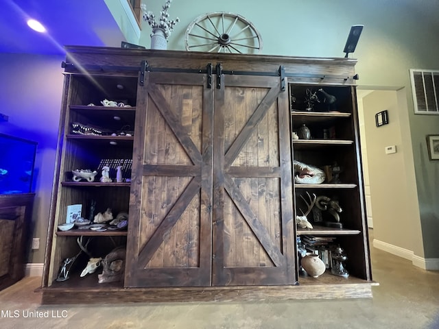 bar with baseboards and visible vents