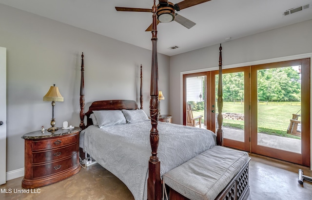 bedroom with finished concrete flooring, visible vents, and access to exterior