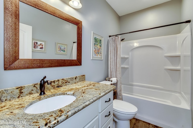 bathroom featuring vanity, shower / tub combo with curtain, wood finished floors, and toilet