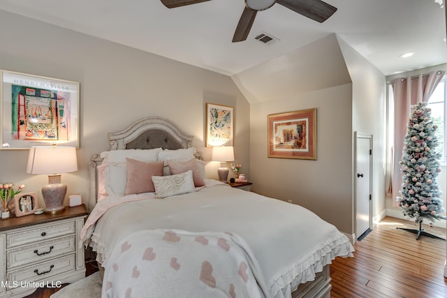bedroom featuring a ceiling fan, hardwood / wood-style flooring, and visible vents