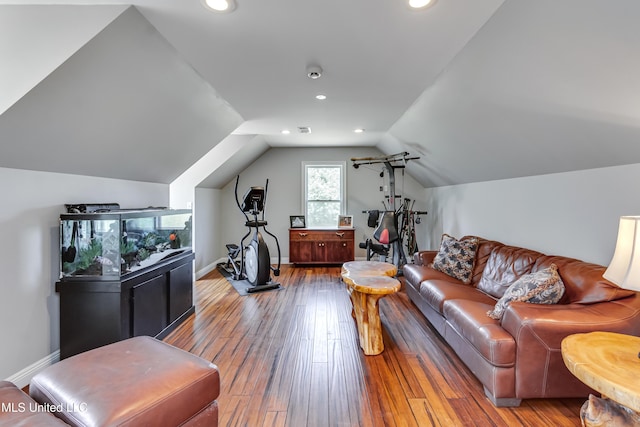 living area featuring baseboards, vaulted ceiling, recessed lighting, and hardwood / wood-style floors