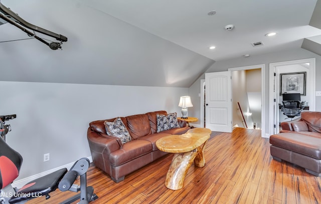 living room featuring visible vents, recessed lighting, light wood-style flooring, and lofted ceiling