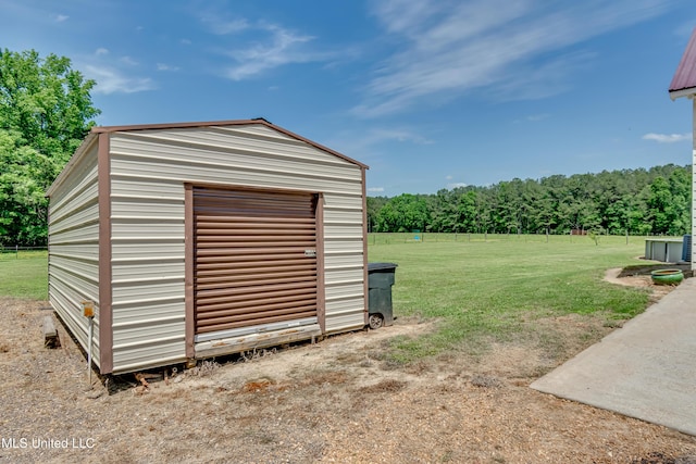view of shed featuring a wooded view