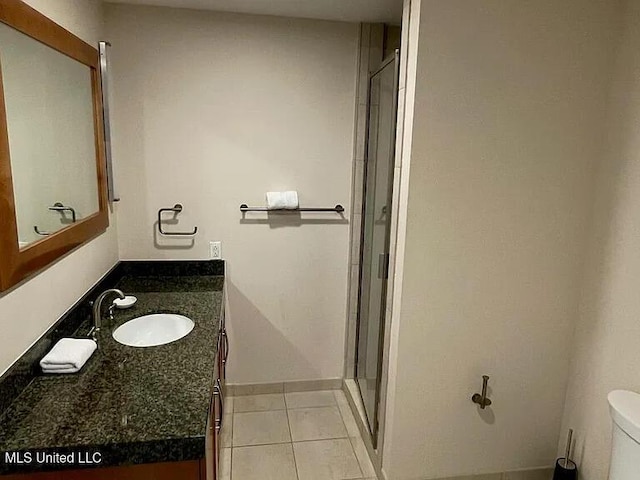 2060 Beach Blvd Unit 1206, Biloxi, MS 39531 - bathroom with vanity, tile patterned flooring, and a stall shower