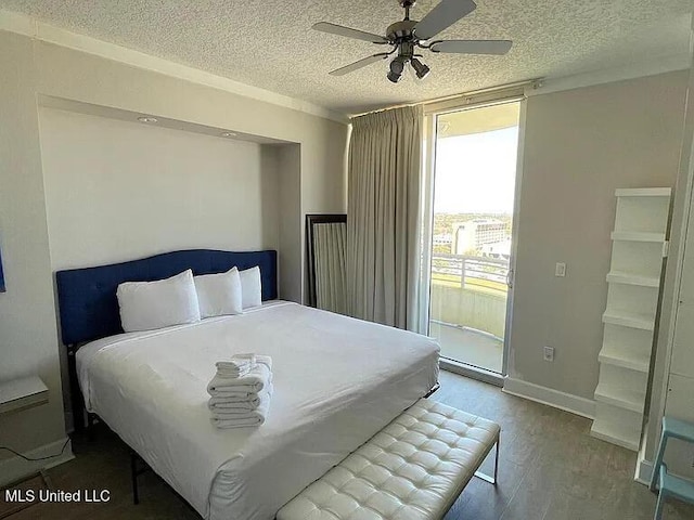 2060 Beach Blvd Unit 1206, Biloxi, MS 39531 - bedroom featuring wood finished floors, a textured ceiling, ceiling fan, and access to outside