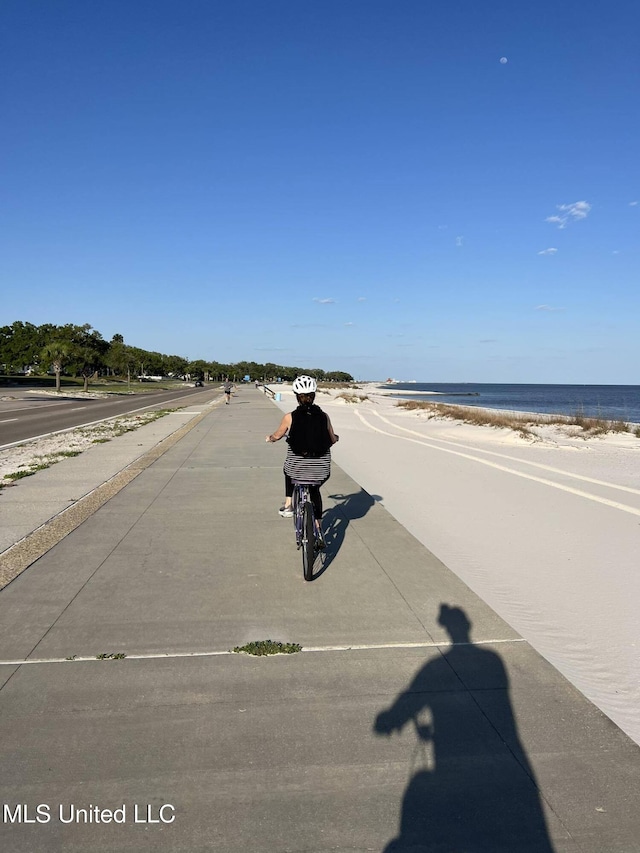 2060 Beach Blvd Unit 1206, Biloxi, MS 39531 - view of asphalt road with sidewalks and a water view