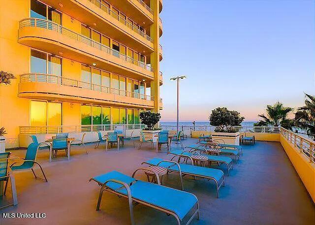 2060 Beach Blvd Unit 1206, Biloxi, MS 39531 - patio terrace at dusk featuring a water view and a balcony
