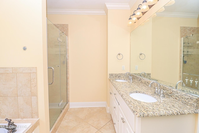 full bathroom featuring crown molding, a shower stall, and a sink