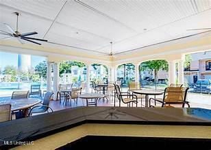 exterior space featuring ceiling fan and outdoor dining area