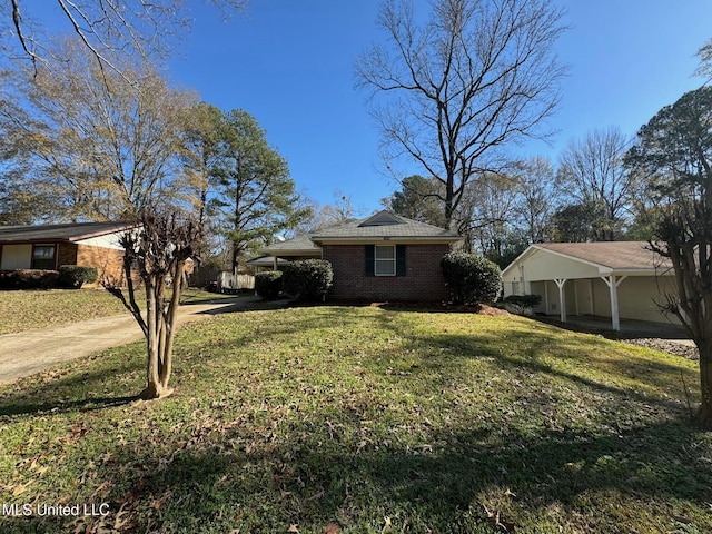 view of side of home with a yard