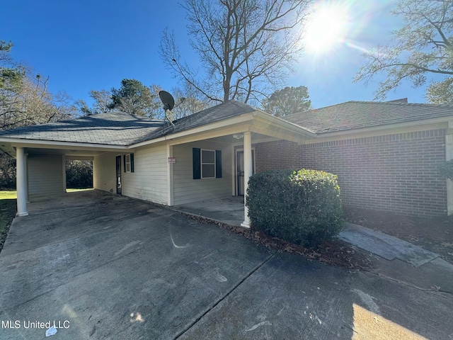 view of front of house featuring a carport