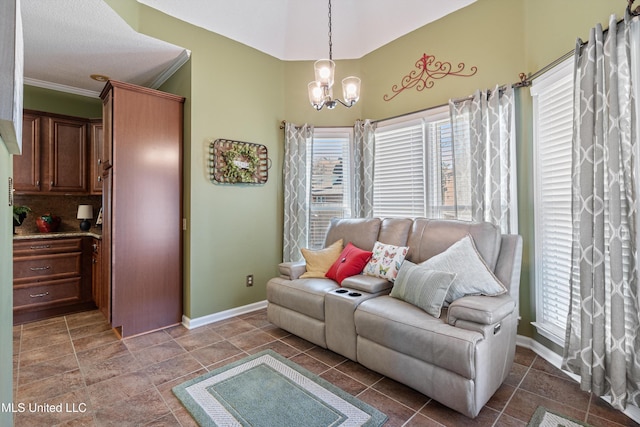 9476 Plantation Rd, Olive Branch, MS 38654 - living room with baseboards, a notable chandelier, and crown molding