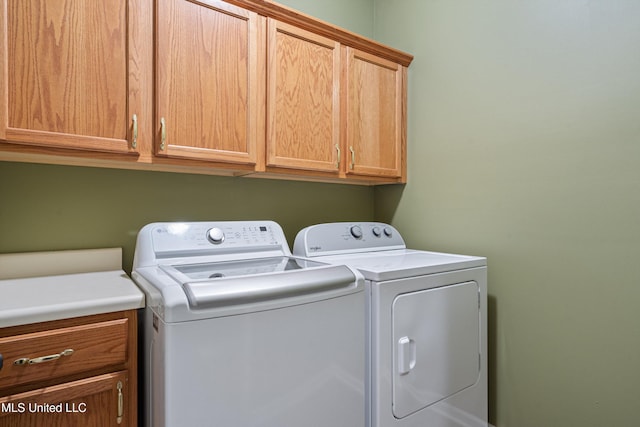 9476 Plantation Rd, Olive Branch, MS 38654 - washroom with cabinet space and washer and clothes dryer