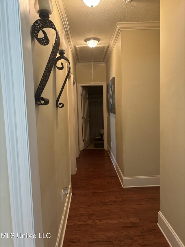 140 Devlin Springs Dr, Madison, MS 39110 - corridor with attic access, ornamental molding, baseboards, dark wood-style floors, and a textured ceiling