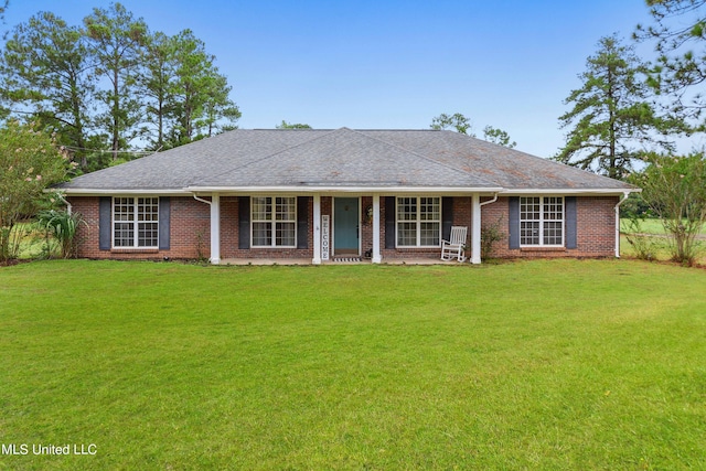 single story home featuring a front yard and covered porch