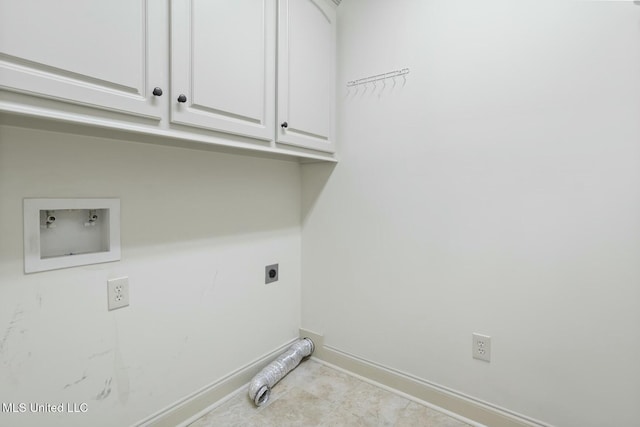 washroom with cabinet space, hookup for an electric dryer, baseboards, and washer hookup