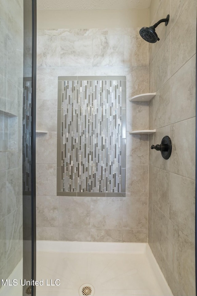 full bathroom with a shower stall