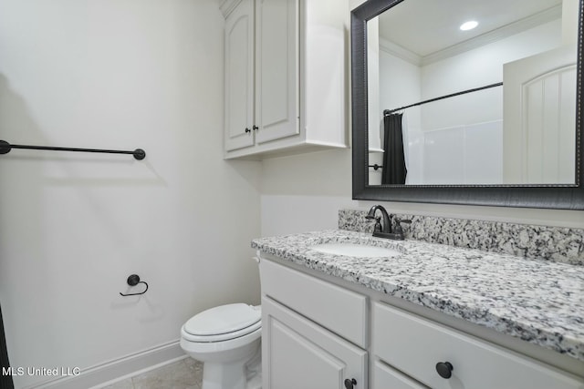 bathroom featuring vanity, baseboards, crown molding, tile patterned floors, and toilet