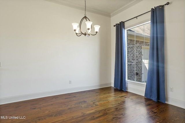 empty room featuring a chandelier, crown molding, baseboards, and wood finished floors