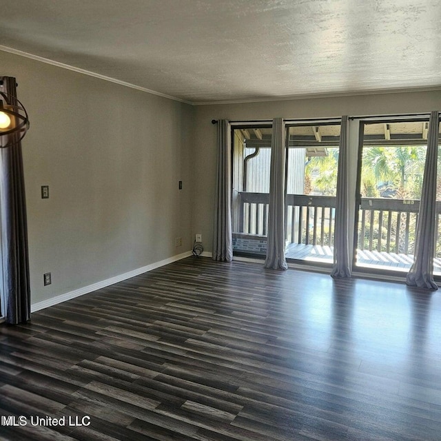 266 Lanai Unit U, Diamondhead, MS 39525 - empty room featuring crown molding, baseboards, a textured ceiling, and dark wood-type flooring
