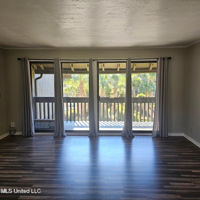 266 Lanai Unit U, Diamondhead, MS 39525 - empty room featuring crown molding, a textured ceiling, baseboards, and wood finished floors