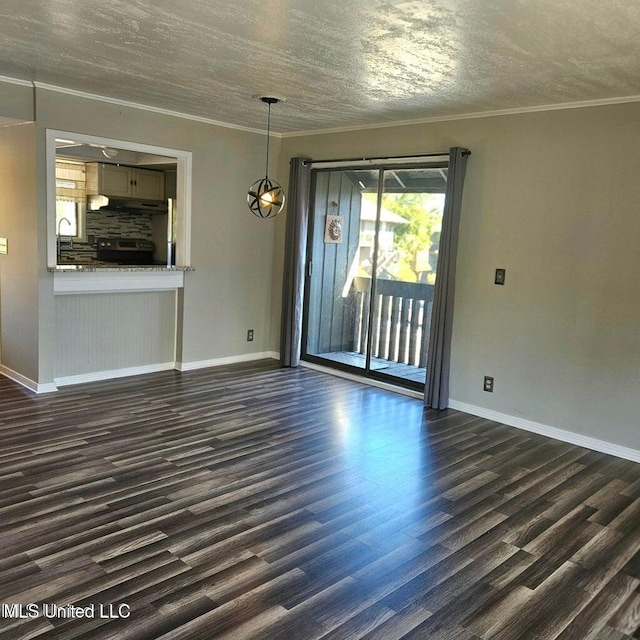 266 Lanai Unit U, Diamondhead, MS 39525 - unfurnished living room with dark wood-type flooring, ornamental molding, baseboards, and a textured ceiling