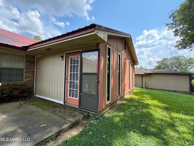 view of property exterior with a yard