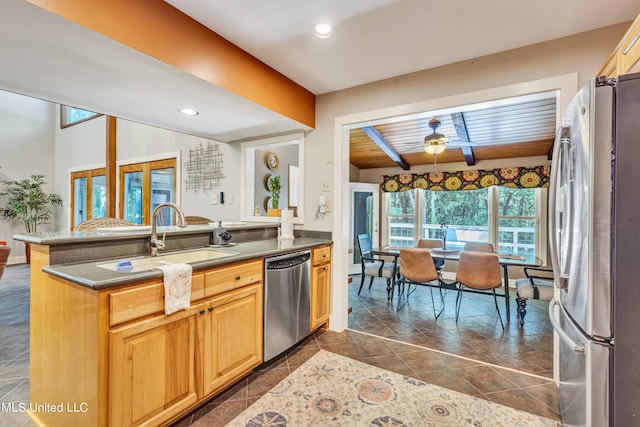 kitchen featuring appliances with stainless steel finishes, sink, wooden ceiling, and plenty of natural light