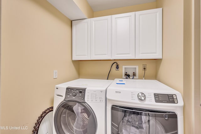 laundry area with cabinets and independent washer and dryer