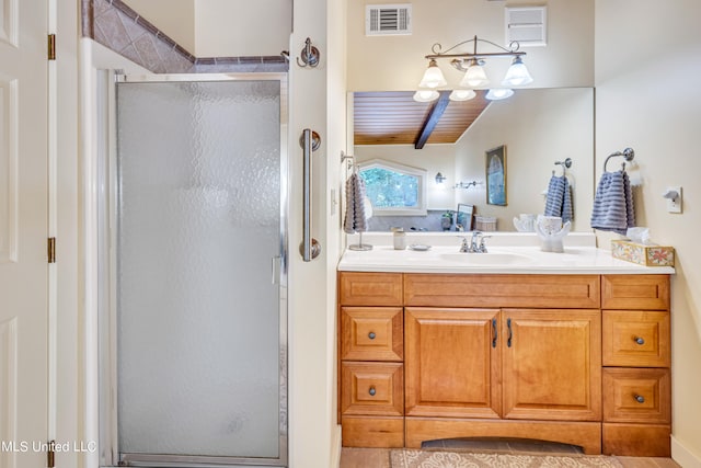 bathroom with a shower with door, vanity, vaulted ceiling, and wooden ceiling