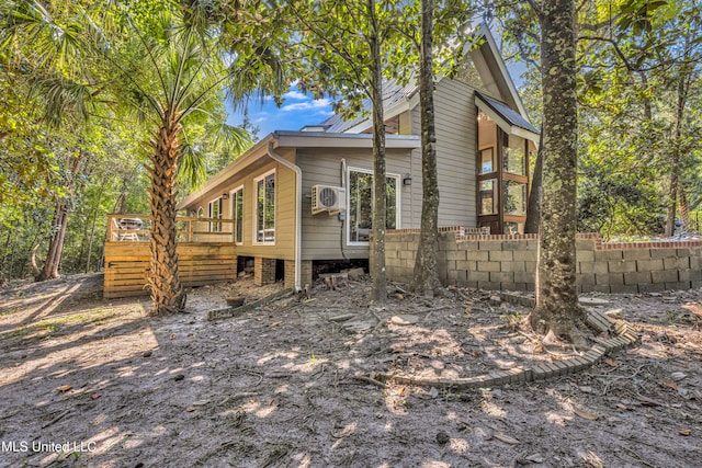 view of property exterior with a deck