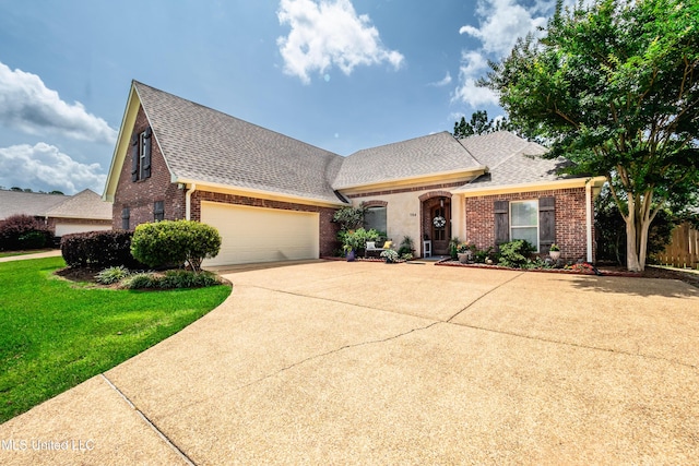 704 Tortoise Rdg, Brandon, MS 39047 - view of front facade featuring brick siding, a shingled roof, and driveway