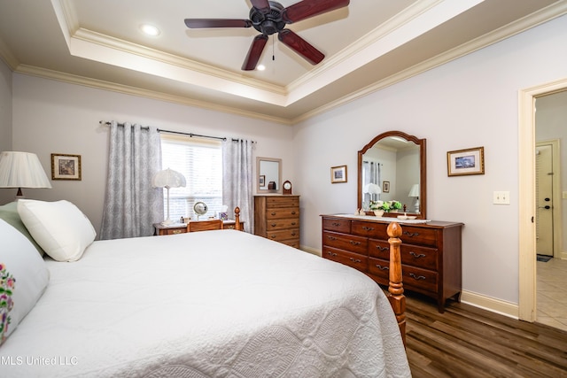 704 Tortoise Rdg, Brandon, MS 39047 - bedroom featuring a raised ceiling, crown molding, wood finished floors, baseboards, and a ceiling fan