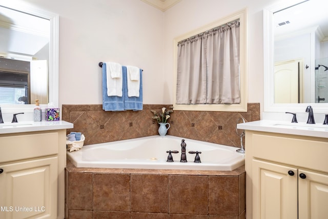 704 Tortoise Rdg, Brandon, MS 39047 - full bathroom featuring two vanities, a bath, and crown molding
