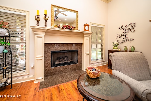 704 Tortoise Rdg, Brandon, MS 39047 - living area featuring a fireplace with flush hearth, light wood-type flooring, baseboards, and crown molding