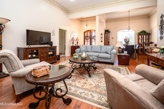 704 Tortoise Rdg, Brandon, MS 39047 - living room with wood finished floors, ornamental molding, and a chandelier