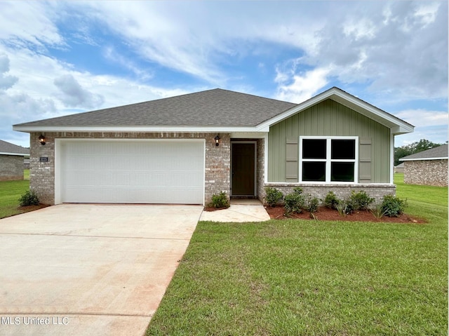 view of front of house with a front lawn and a garage