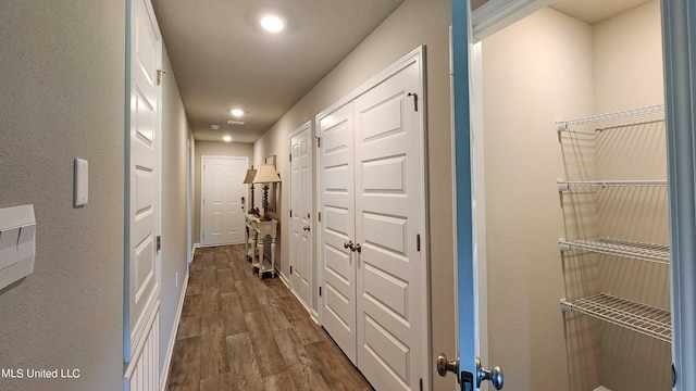 hall featuring dark wood-type flooring