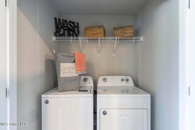 clothes washing area with independent washer and dryer